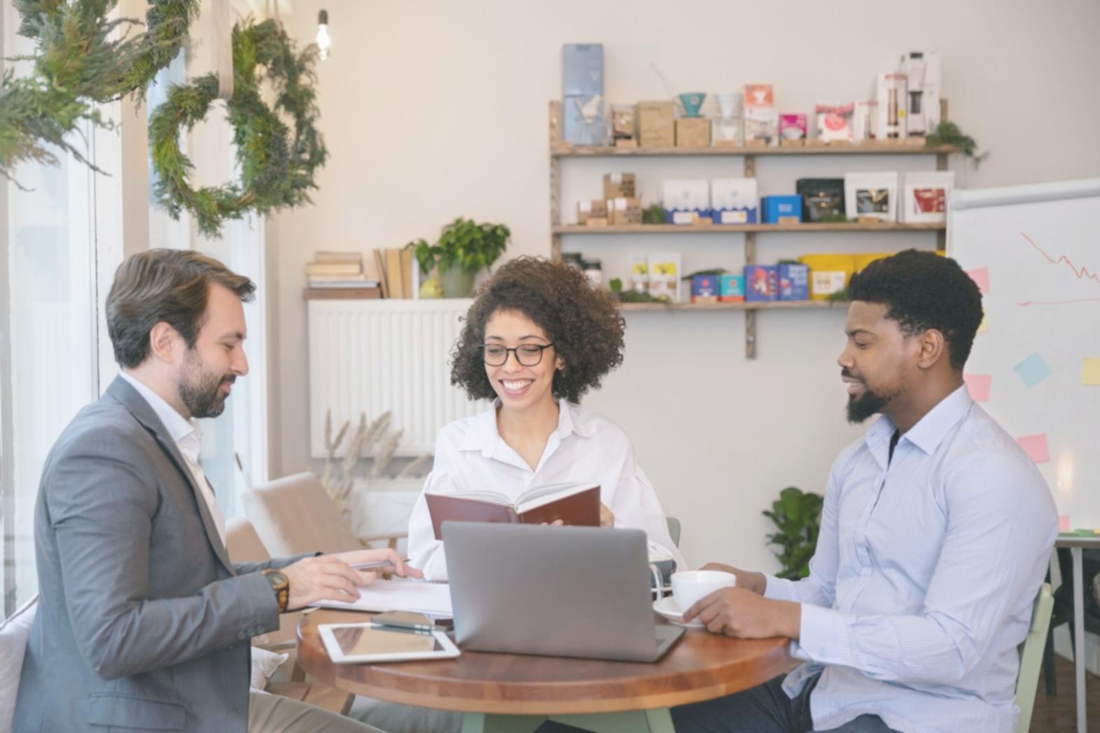 Group of participants reviewing budget plans together in collaborative learning environment